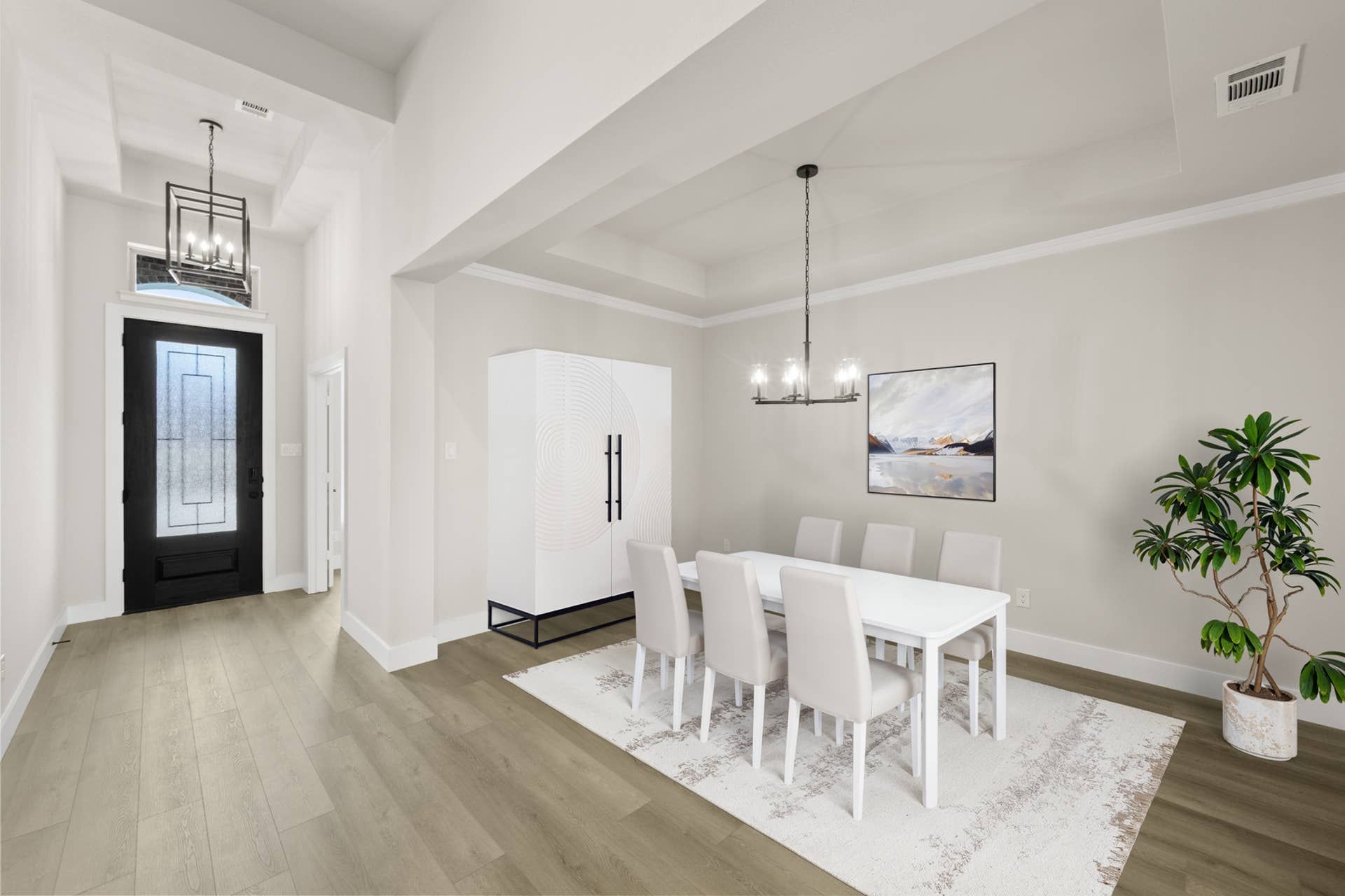 Elegant dining room with modern chandelier and light wood flooring.