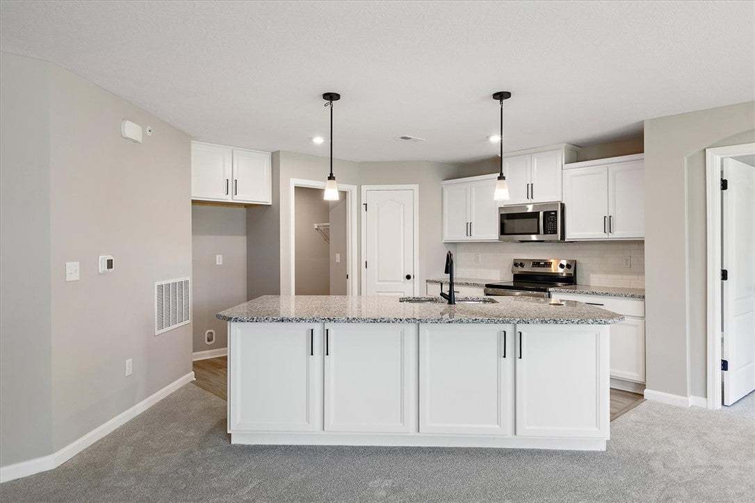 This modern kitchen features a spacious island wit