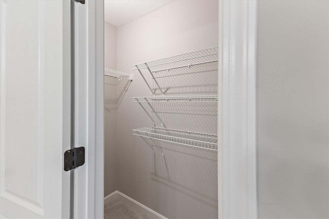 Ample wire shelving provides organized storage in