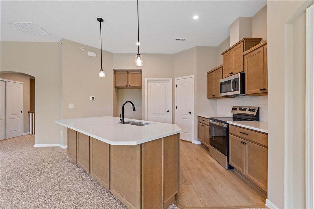 This contemporary kitchen features an inviting isl