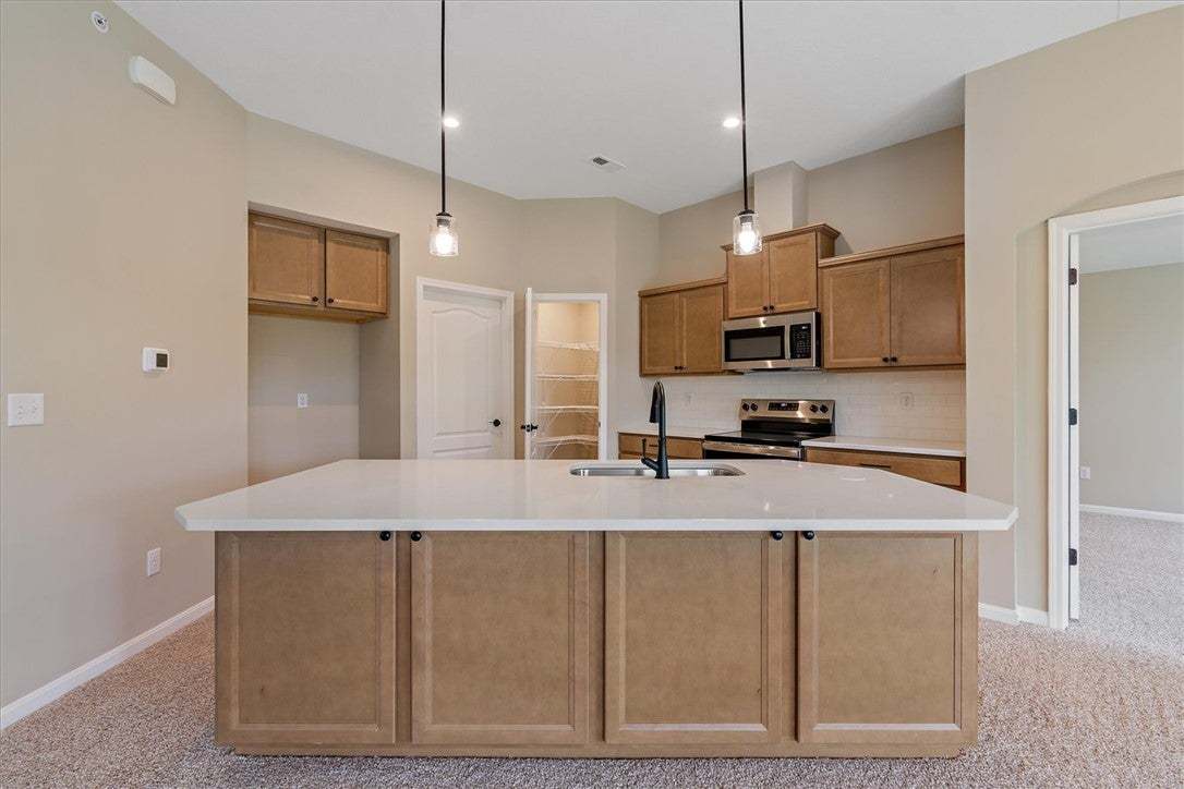 A contemporary kitchen features an inviting island