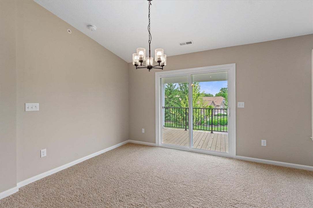 This living area features a modern chandelier and