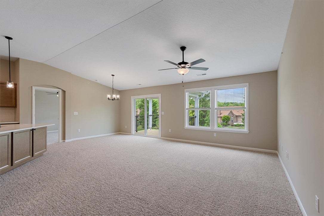 A spacious common area with plush carpeting, offer