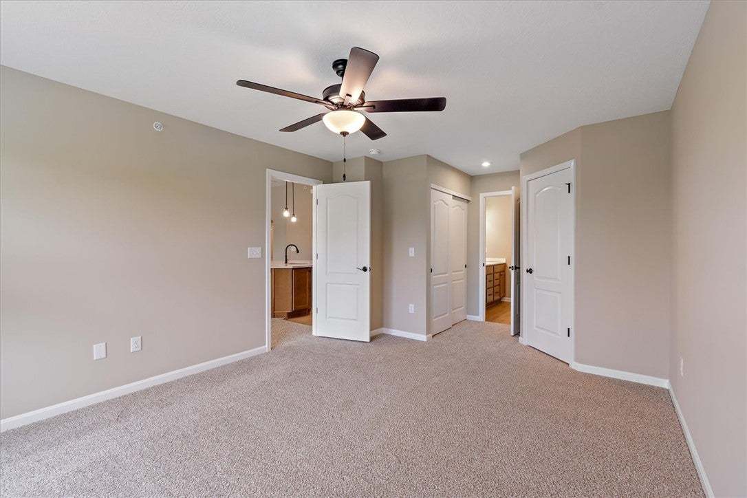 This ample bedroom provides comfortable carpet flo