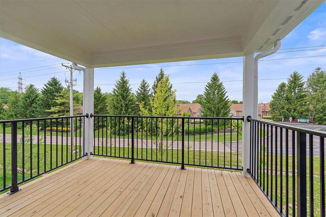 An inviting outdoor deck provides a serene space w