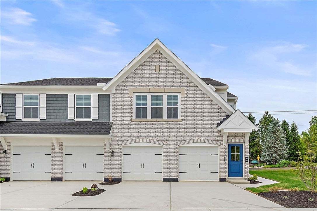 This newly constructed townhouse facade features a