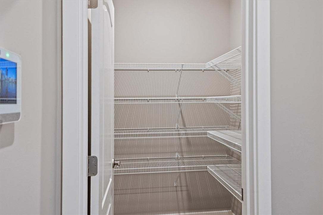 This kitchen pantry features abundant wire shelvin