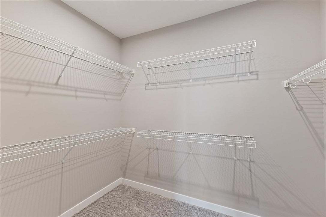 This organized closet space features wire shelving