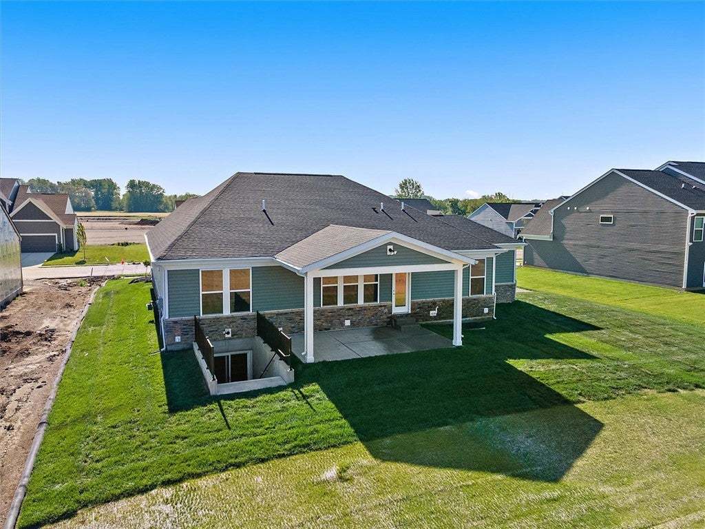 The rear exterior showcases a covered patio overlo