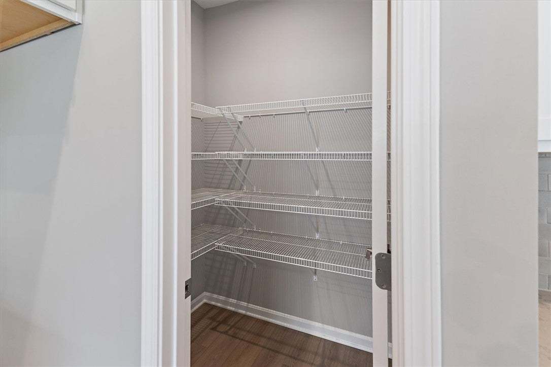 This spacious pantry provides ample storage with e