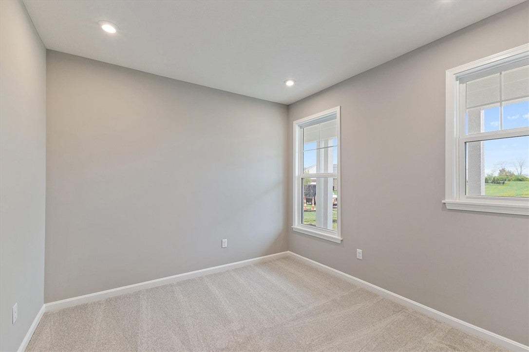 This bright room features windows that fill the sp