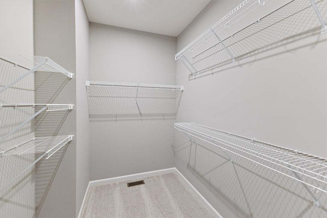 Functional closet with ample shelving provides con