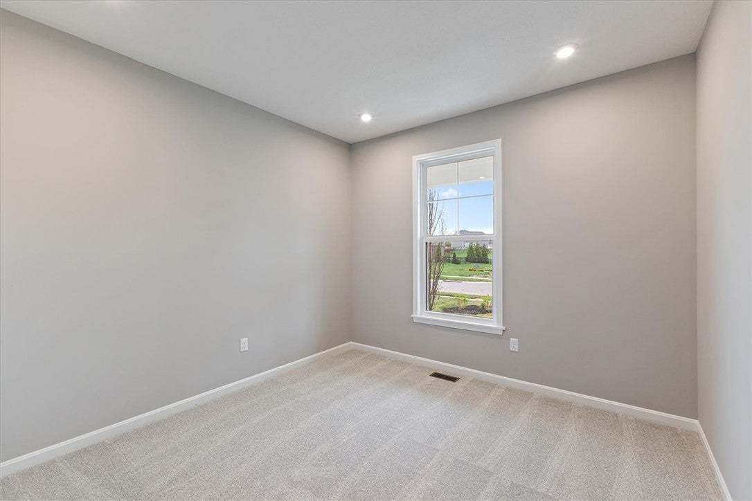 This bright bedroom offers a serene space with amp
