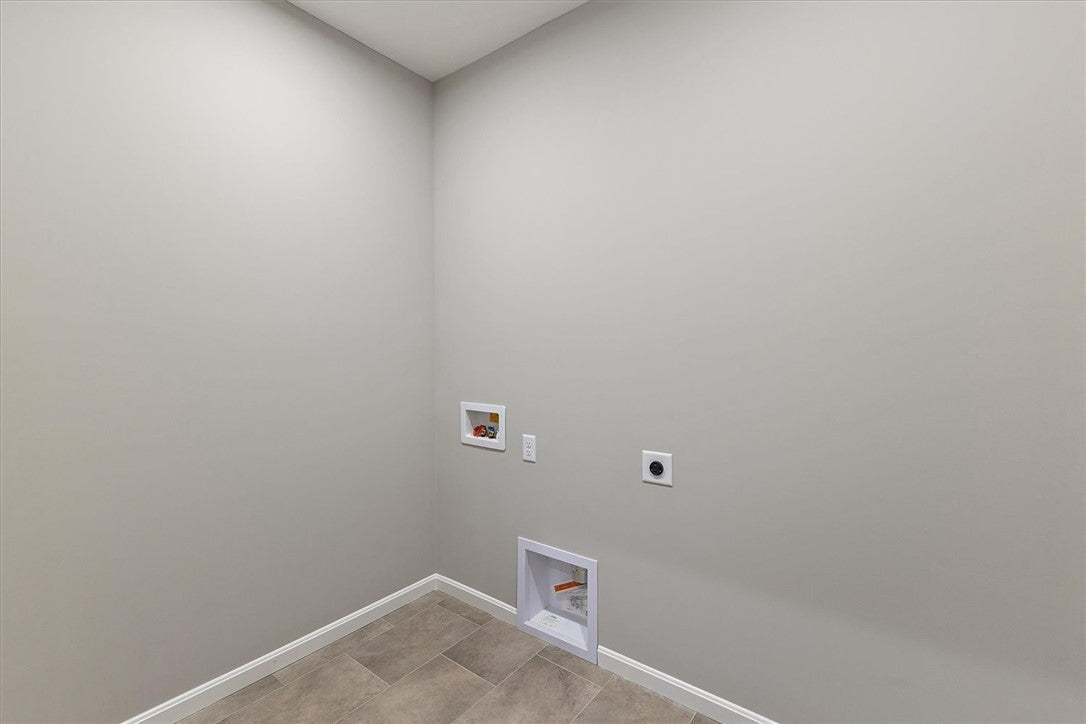 This dedicated laundry space offers convenience wi