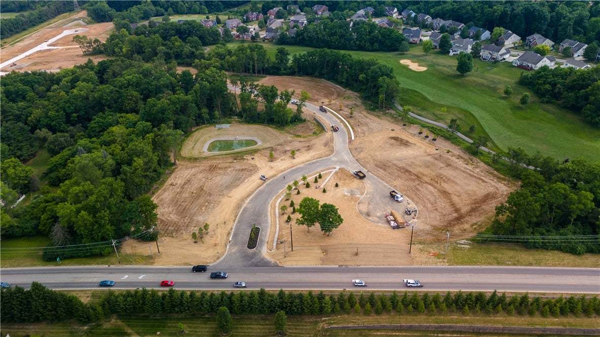 An aerial panorama reveals a nascent residential d