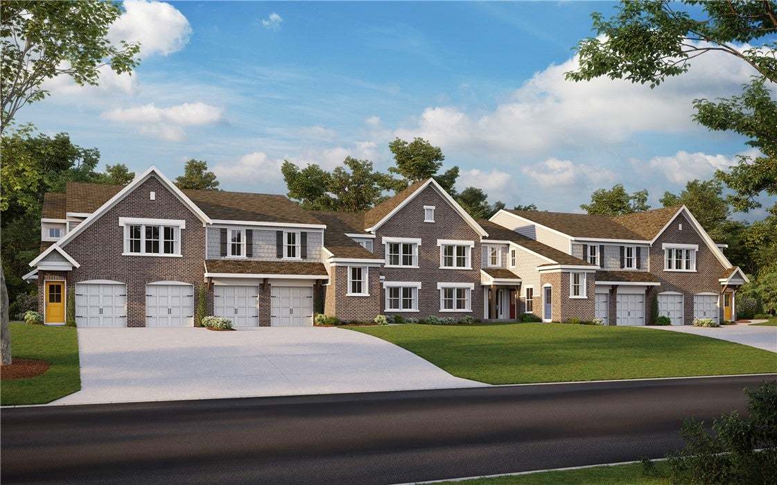 These charming townhomes feature brick and siding