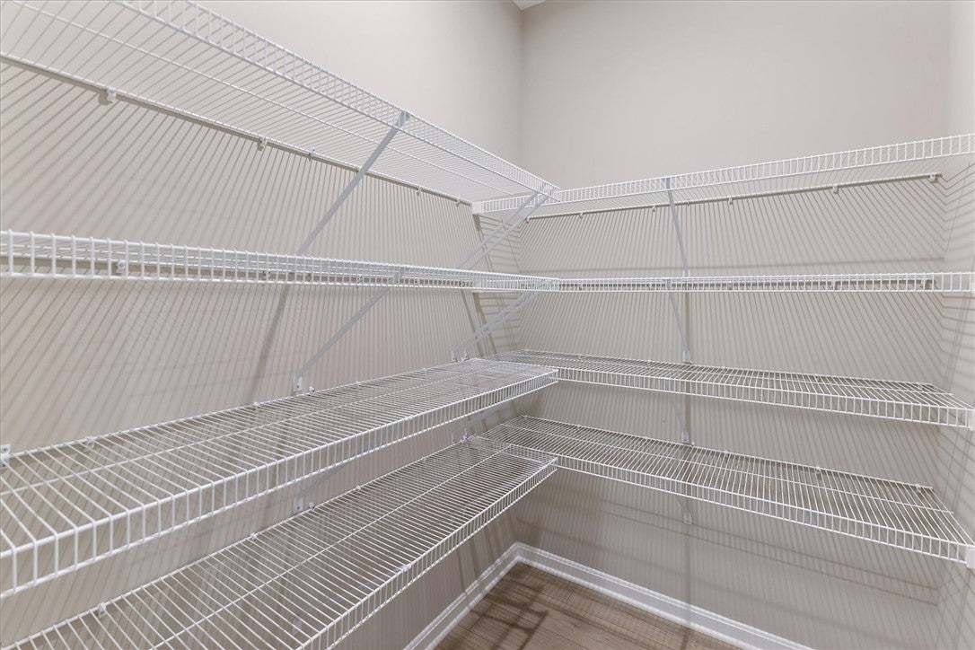 Ample wire shelving lines this functional storage