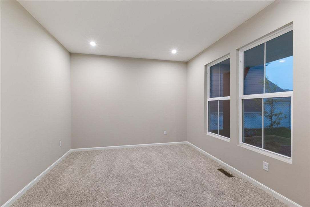Plush carpeting and recessed lighting define this