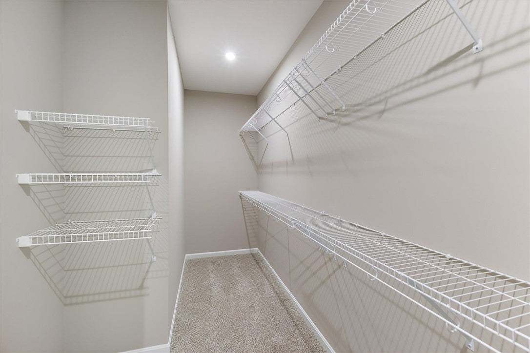 Ample wire shelving lines this functional walk-in