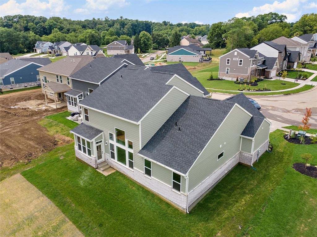 Multi-level rooflines and a textured foundation de