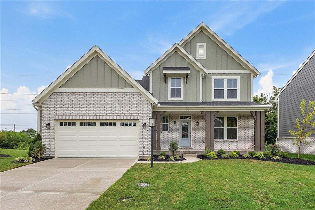 Brick and vertical siding details define this clas