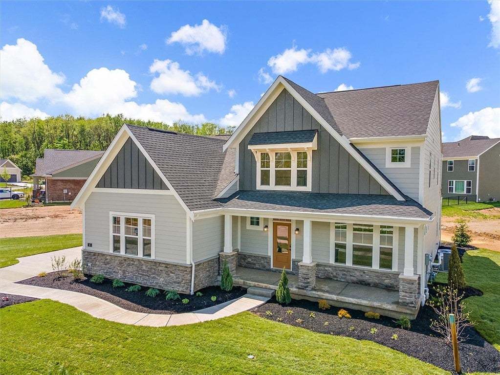 This charming residence features a welcoming porch