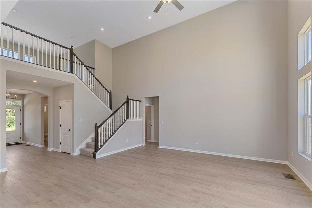 Grand two-story living room with a spacious open f