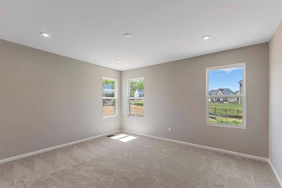 This spacious room features ample natural light an