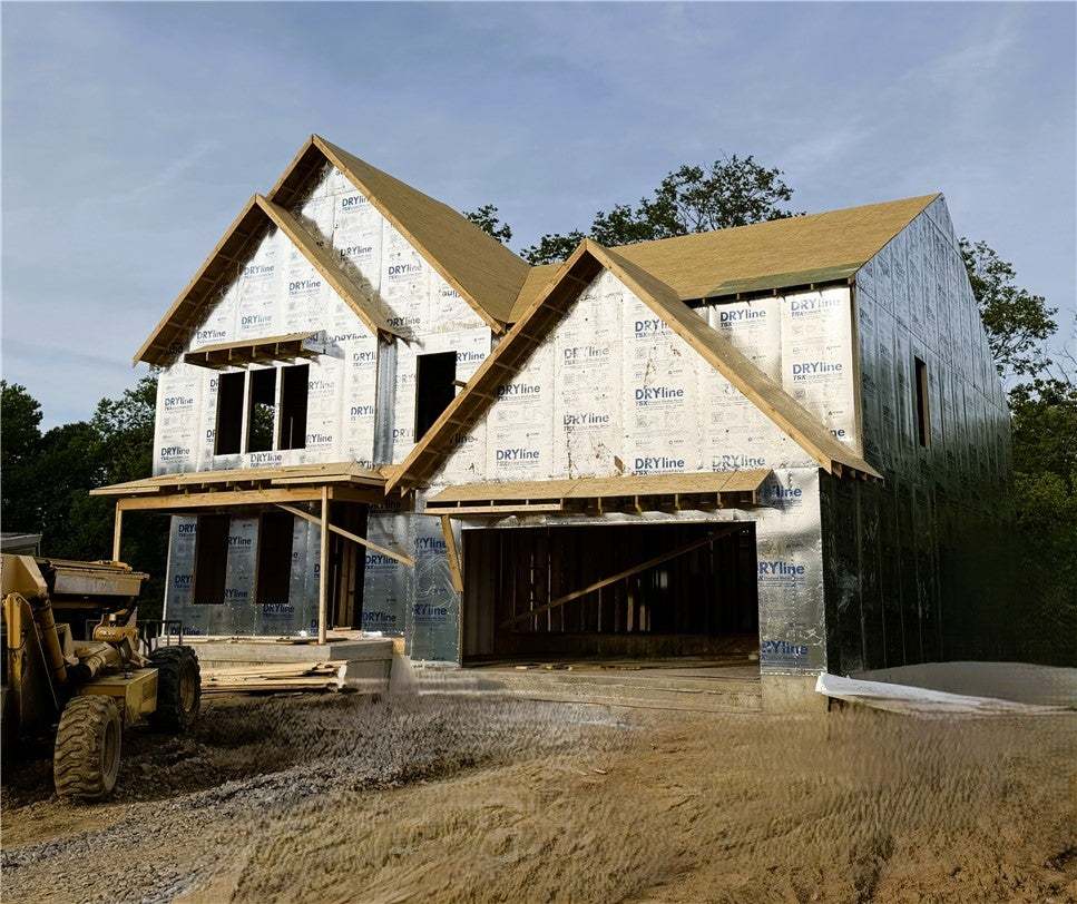 A newly framed residence, sheathed in weather-resi