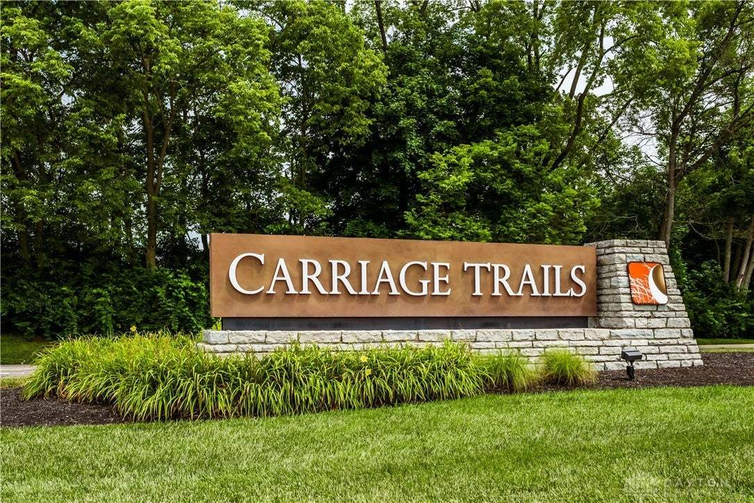Stone and metal signage mark the inviting entrance