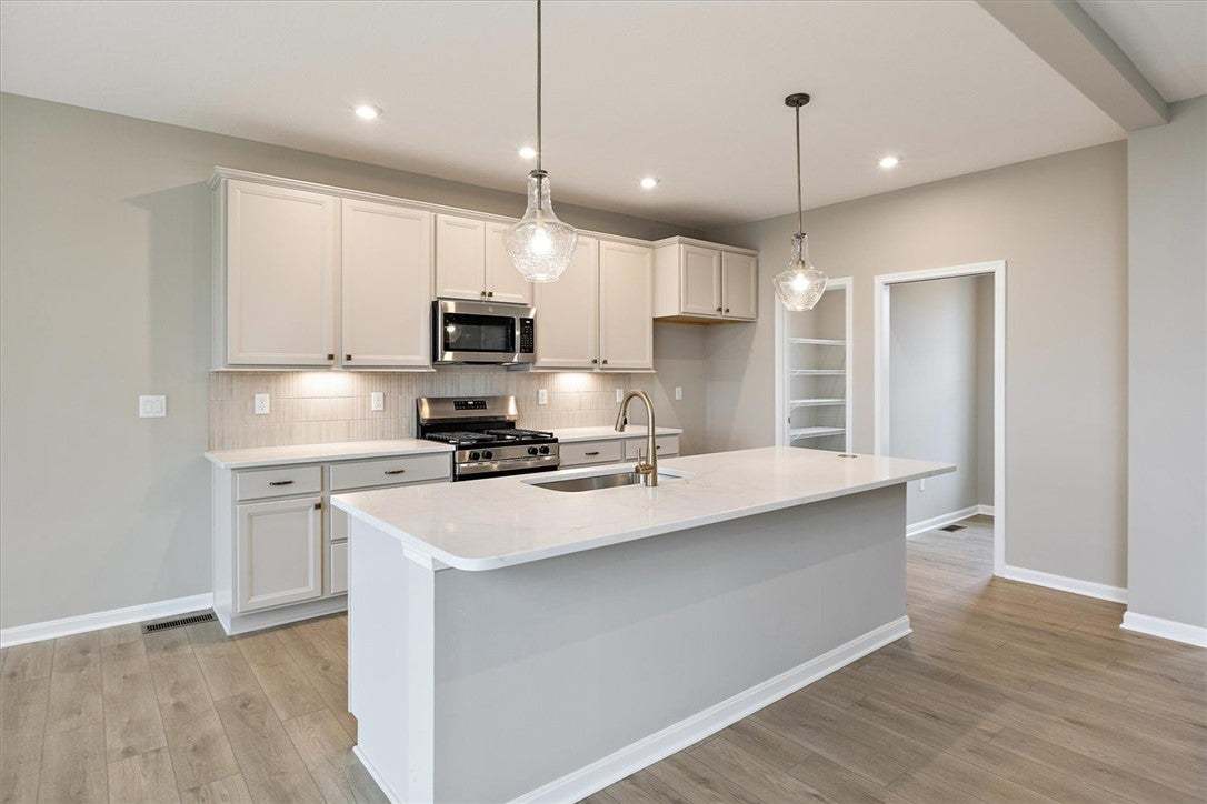 This modern kitchen features a spacious island and