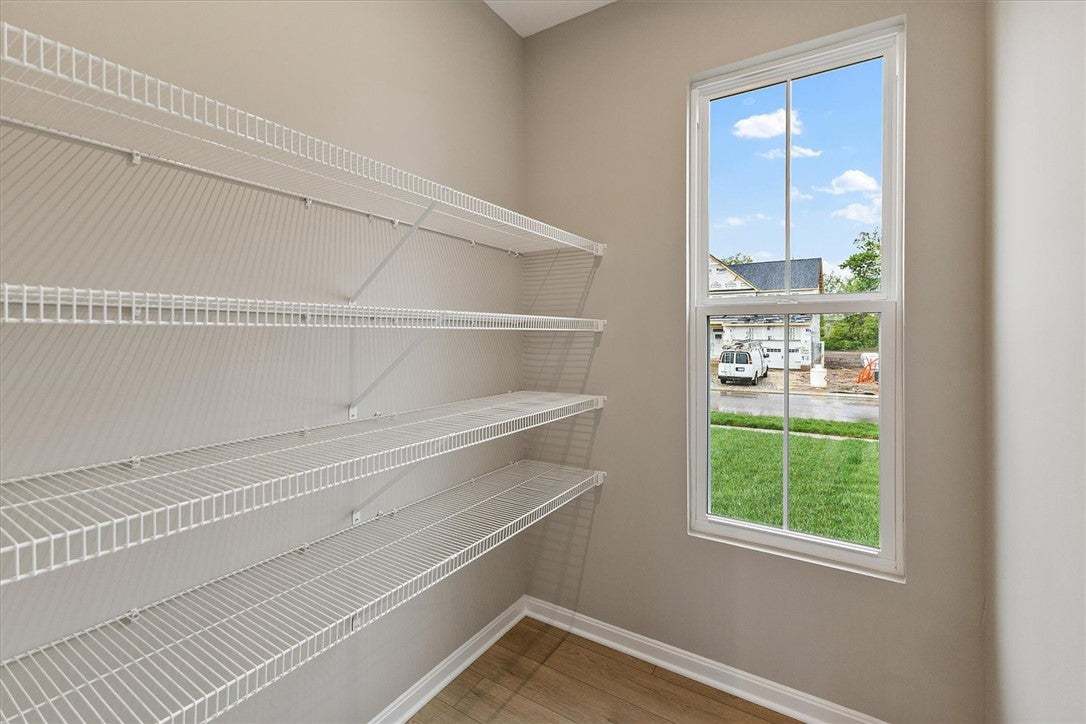 This spacious pantry provides ample storage with f