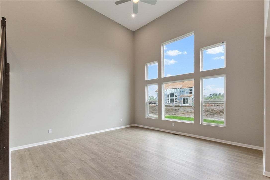 This living area features expansive windows, soari
