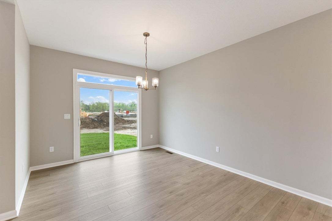 This bright interior space features warm flooring
