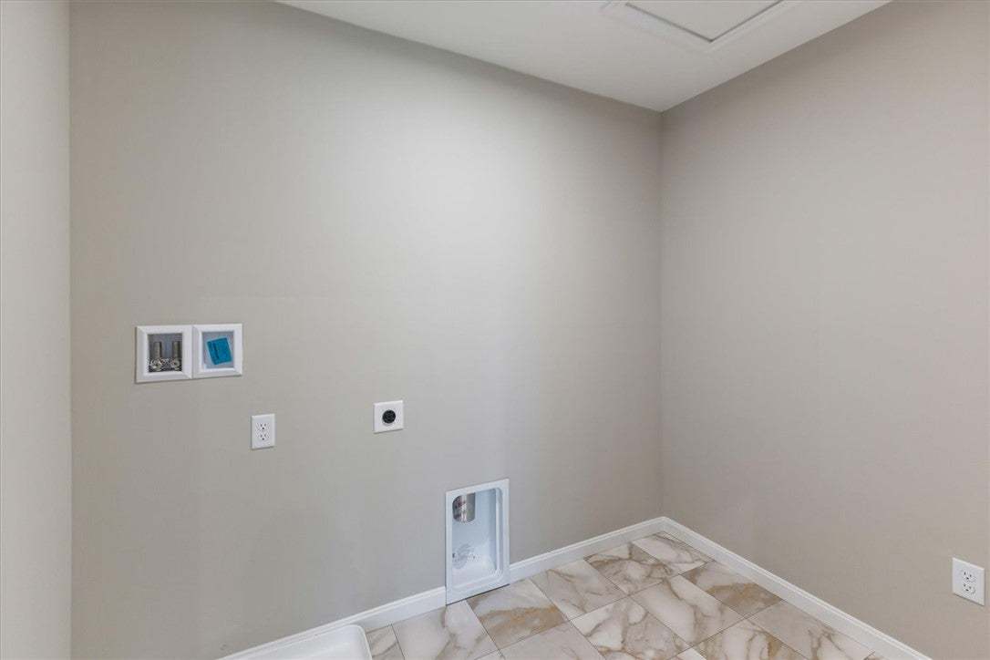 This spacious laundry room offers convenience and