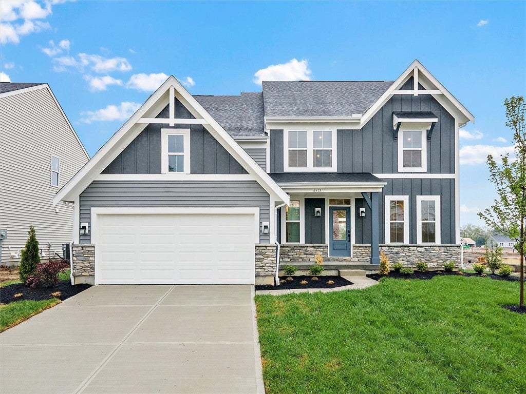 This newly built residence showcases inviting curb