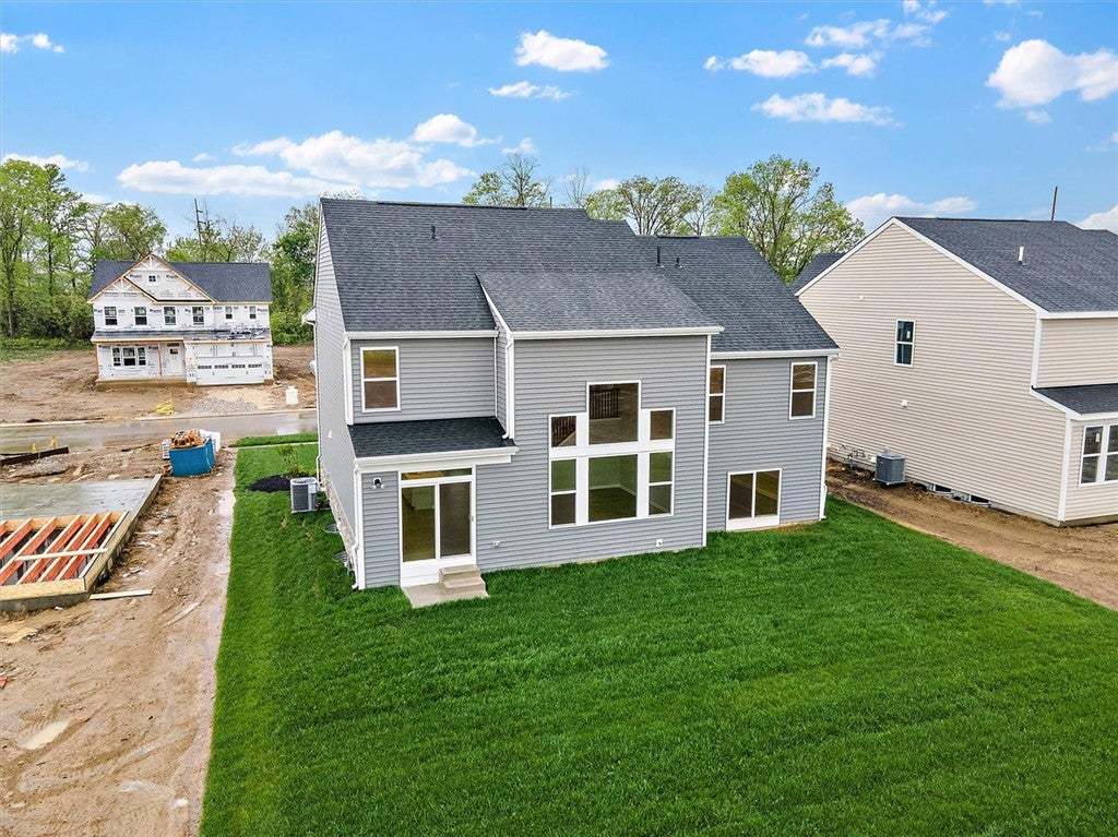 This newly constructed residence showcases a conte
