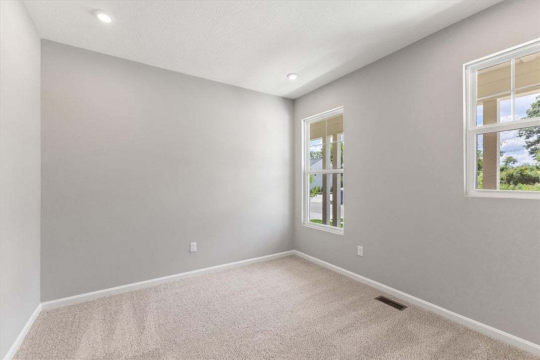 Recessed lighting illuminates this versatile room,