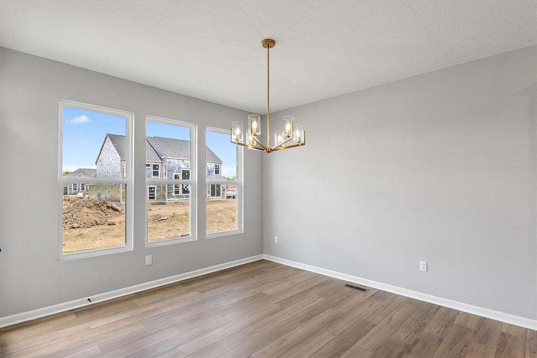 A refined ceiling fixture illuminates the spacious