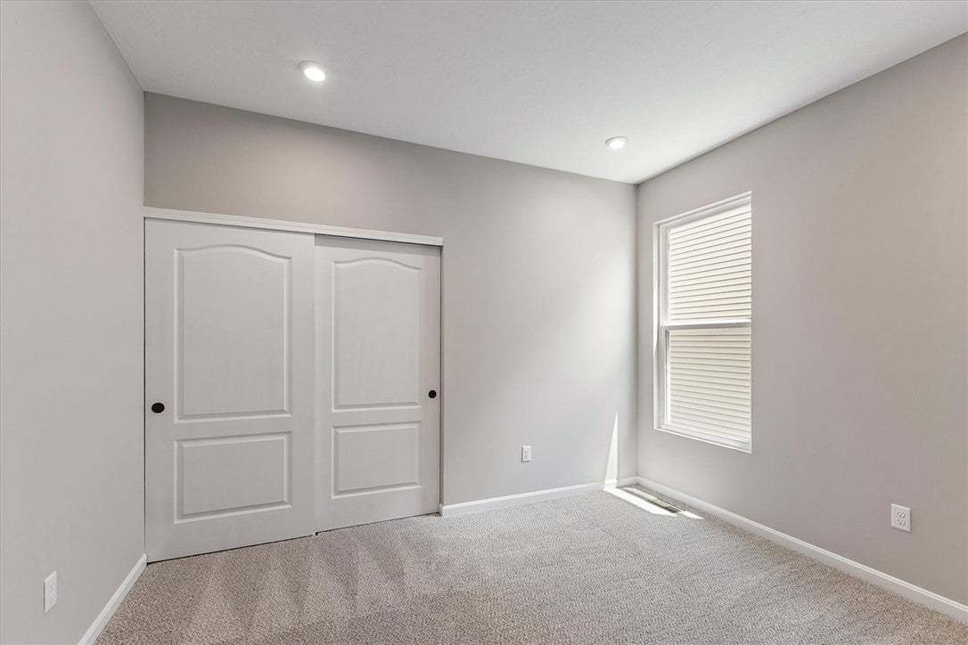 A well-proportioned room featuring bright illumina