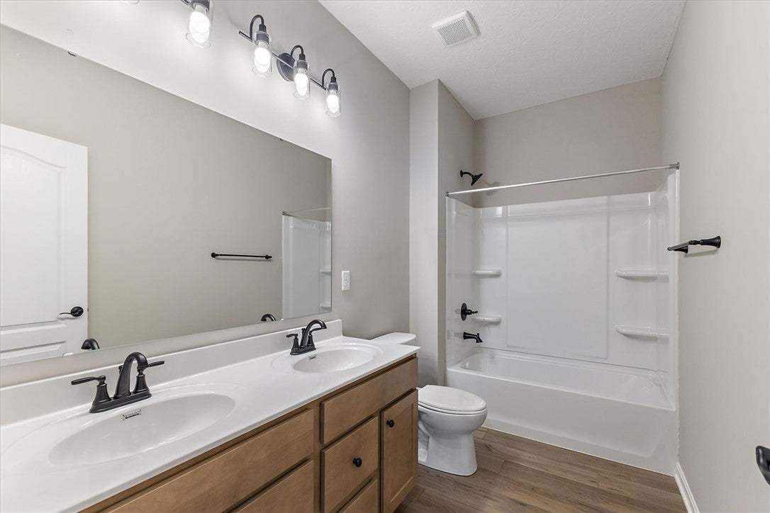 A well-appointed bathroom features a double vanity