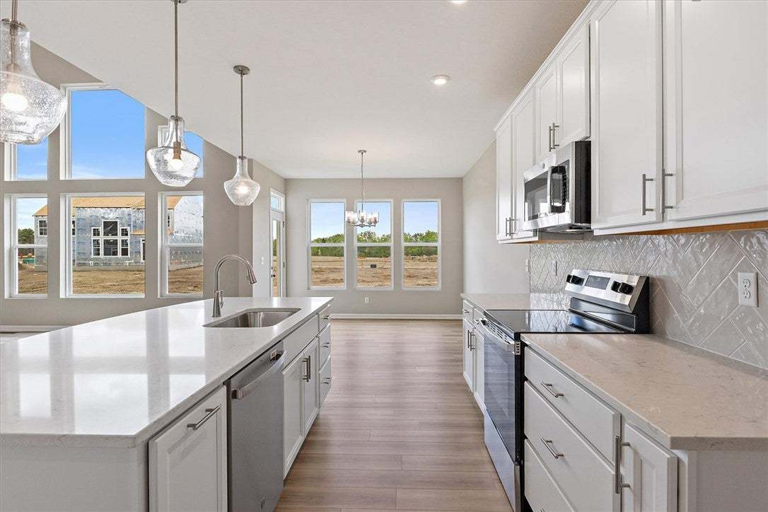 This modern kitchen features bright countertops an