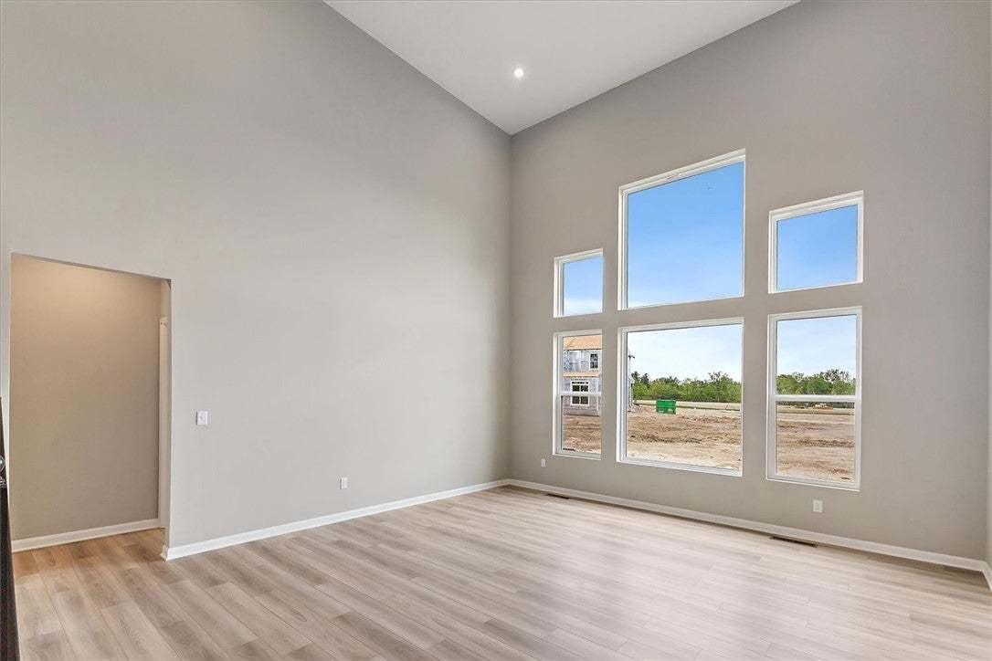 This airy living space features soaring ceilings a