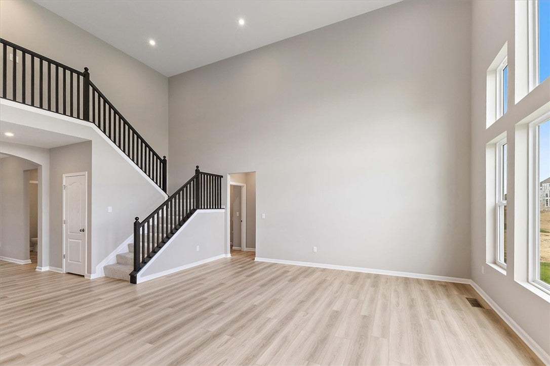 This expansive great room features soaring ceiling
