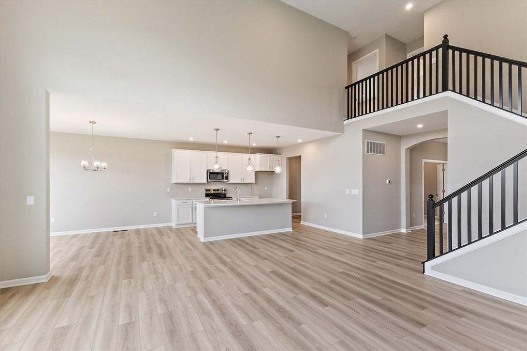 An open-concept interior features modern flooring