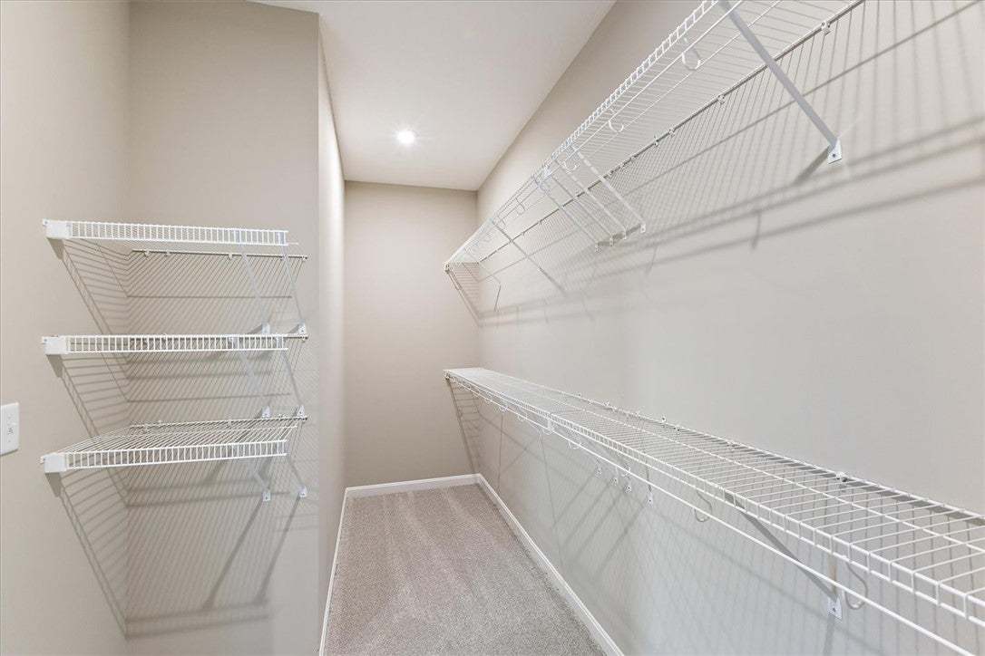 This spacious closet offers ample storage with con