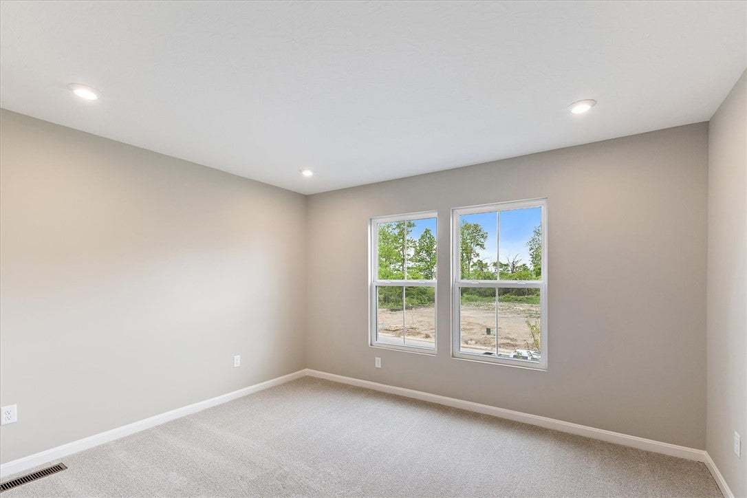 This spacious room features ample natural light an