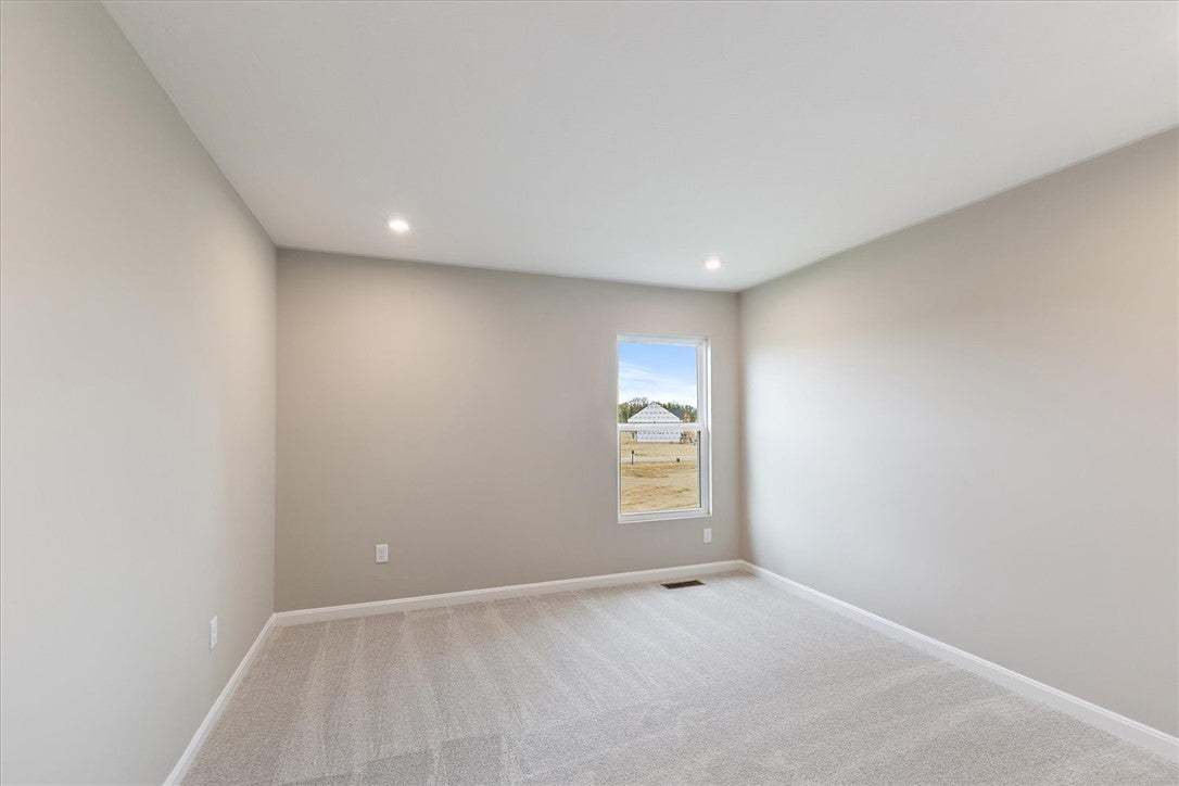 Bright and airy, this room features ample natural