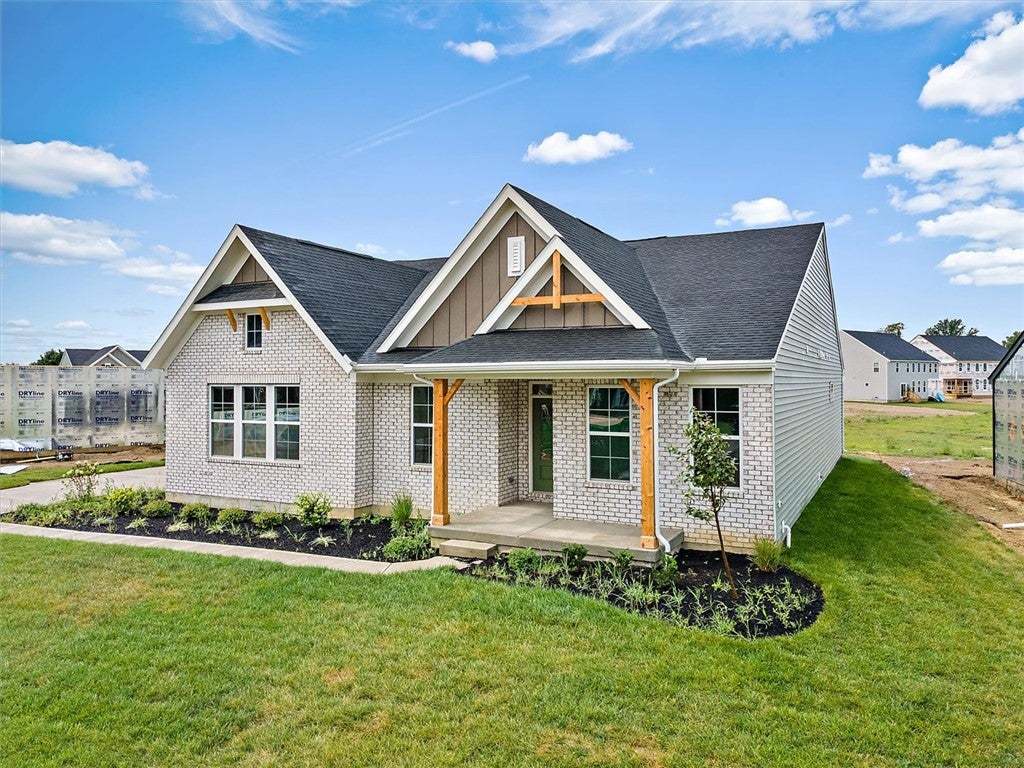 Crafted with white brick and wood accents, this ho