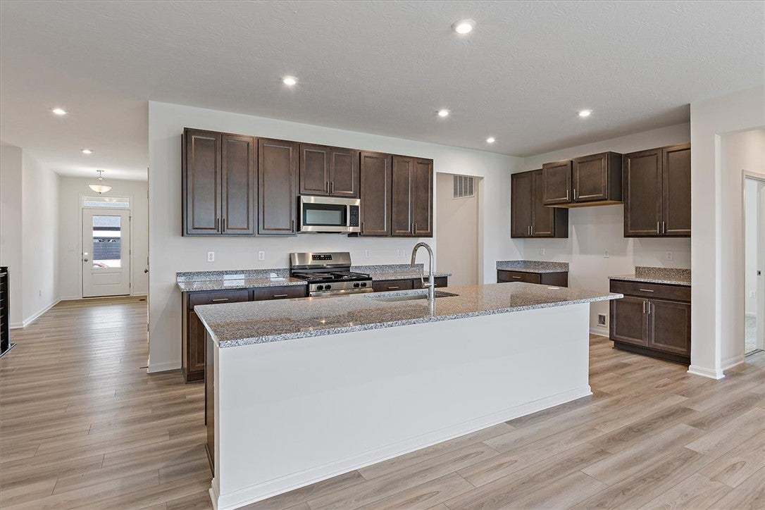 A well-appointed kitchen showcasing a spacious isl